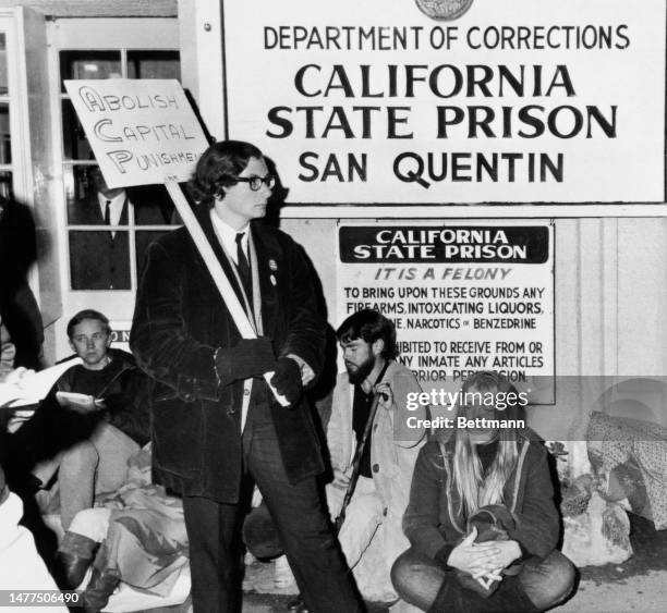 Protesters hold an all-night vigil at San Quentin State Prison in California to protest the scheduled execution of convicted murderer Aaron Mitchell...