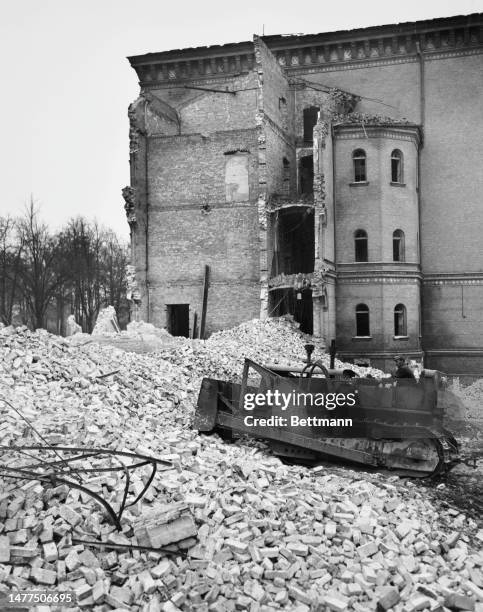 Bulldozer tears down war-damaged structures near the US Army's Andrews Barracks in the Lichterfelde district of Berlin on November 22nd, 1950. The...