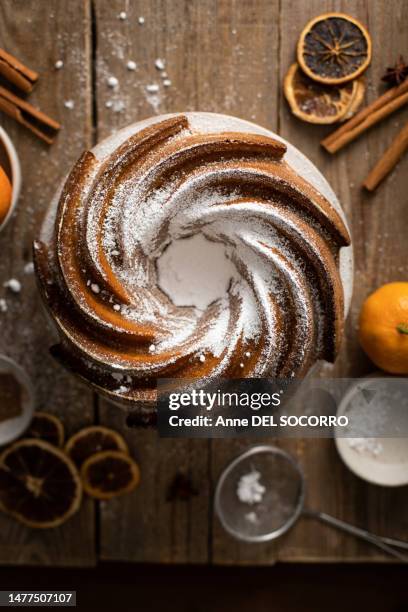 homemade pudding bundt cake with orange and cinnamon - fruit cake stock pictures, royalty-free photos & images