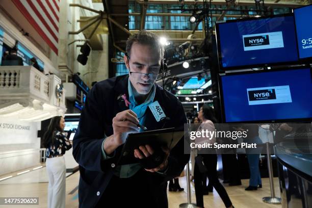 Traders work on the floor of the New York Stock Exchange on March 28, 2023 in New York City. Stocks were down slightly in morning trading as a...