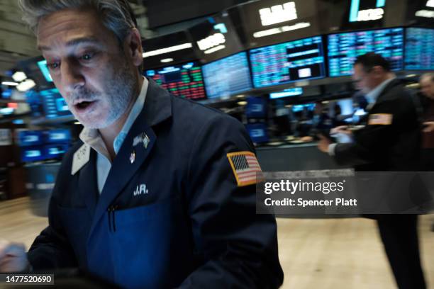 Traders work on the floor of the New York Stock Exchange on March 28, 2023 in New York City. Stocks were down slightly in morning trading as a...