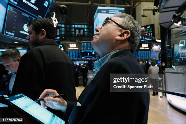 Traders work on the floor of the New York Stock Exchange on March 28, 2023 in New York City. Stocks were down slightly in morning trading as a...