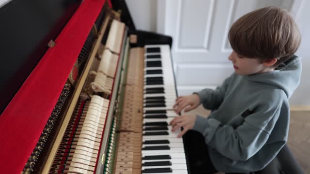 School Boy Playing Piano