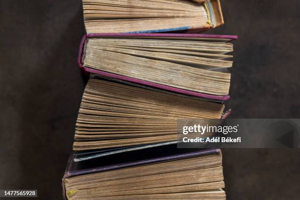 top view of vintage hardback books - old book cover stock pictures, royalty-free photos & images