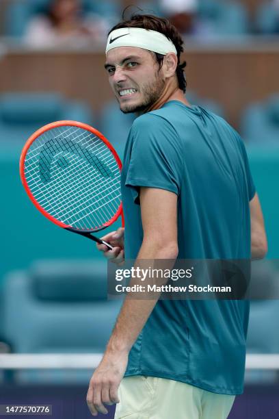 Taylor Fritz celebrates while playing Holger Rune of Denmark during the Miami Open at Hard Rock Stadium on March 28, 2023 in Miami Gardens, Florida.