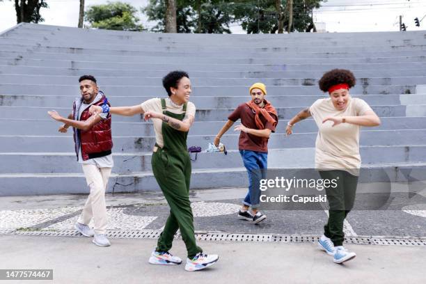 cheerful group of friends practicing dance routines together - funk music stock pictures, royalty-free photos & images