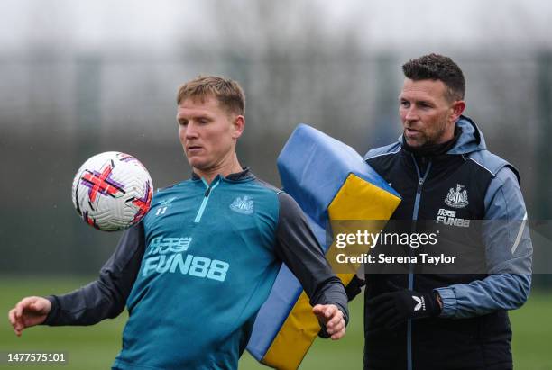 Matt Ritchie controls the ball as First Team Coach Stephen Purches uses a training pad during the Newcastle United Training session at the Newcastle...