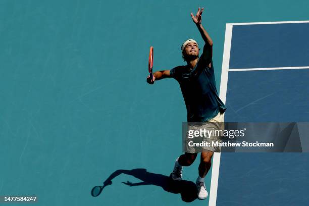 Taylor Fritz serves to Holger Rune of Denmark during the Miami Open at Hard Rock Stadium on March 28, 2023 in Miami Gardens, Florida.