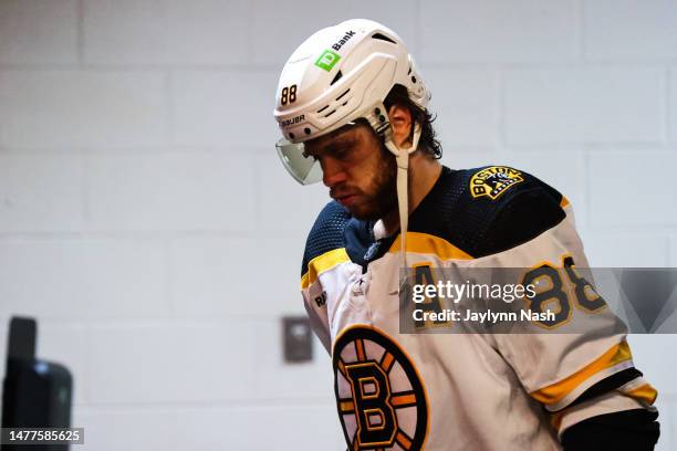 David Pastrnak of the Boston Bruins looks down during the second period of the game against the Carolina Hurricanes at PNC Arena on March 26, 2023 in...