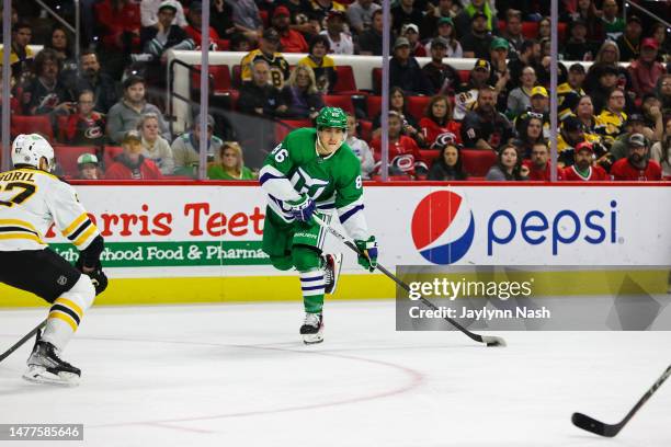 Teuvo Teravainen of the Carolina Hurricanes skates with the puck during the second period of the game against the Boston Bruins at PNC Arena on March...