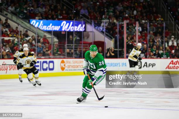 Paul Stastny of the Carolina Hurricanes skates with the puck during the first period of the game against the Boston Bruins at PNC Arena on March 26,...