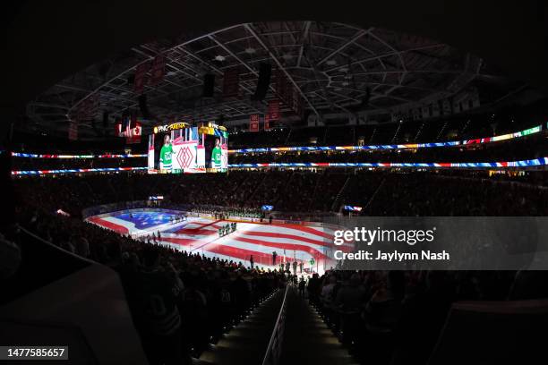 National Anthem as Carolina Hurricanes celebrates Whalers Night during the first period of the game against the Boston Bruins at PNC Arena on March...