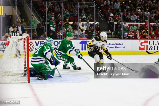 Dmitry Orlov of the Boston Bruins skates with the puck to try to score a goal during the third period of the game against the Boston Bruins at PNC...