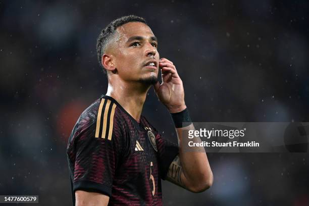 Thilo Kehrer of Germany looks dejected following the team's defeat during the international friendly match between Germany and Belgium at...
