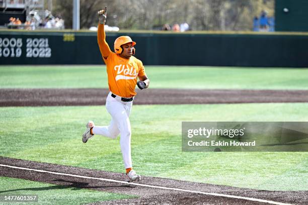 Christian Moore of the Tennessee Volunteers celebrates scoring the winning run against the Texas A&M Aggies in the ninth inning at Lindsey Nelson...