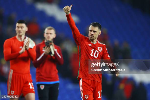 Aaron Ramsey of Wales acknowledges the fans after the team's victory during the UEFA EURO 2024 qualifying round group D match between Wales and...