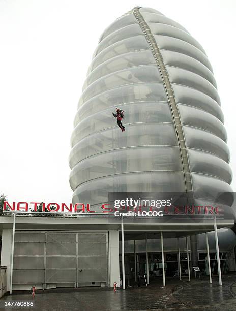 In this handout image provided by LOCOG, Day 46 of the Olympic Flame Torch Relay begins at the National Space Centre as stuntman Eric Scott carries...