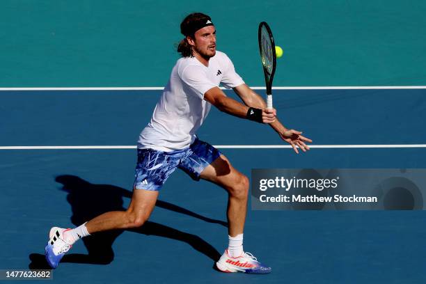 Stefanos Tsitsipas of Greece returns a shot to Karen Khachanov of Russia during the Miami Open at Hard Rock Stadium on March 28, 2023 in Miami...