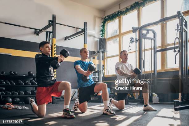 teenagers training with fitness coach - 3 gym stock pictures, royalty-free photos & images