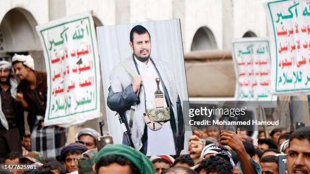 Yemen's Houthi supporters participate in a protest staged to mark the war's 8th anniversary, on March 26, 2023 in Sana'a, Yemen. The eighth...