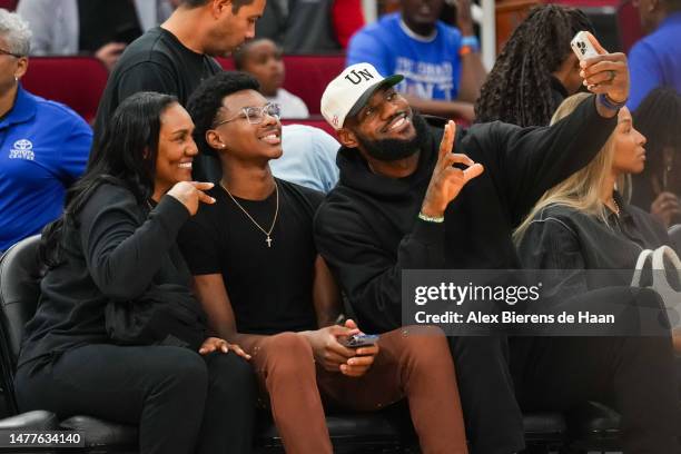 Lebron James of the Los Angeles Lakers takes a selfie with his mother Gloria James and son Bryce James during the 2023 McDonald's High School...