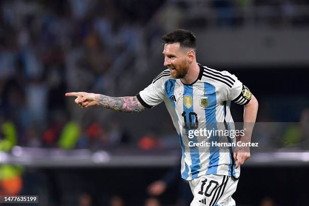 Lionel Messi of Argentina celebrates after scoring the team's first goal during an international friendly match between Argentina and Curaçao at...