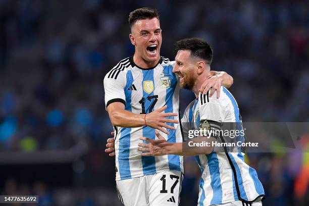 Lionel Messi of Argentina celebrates with teammate Giovani Lo Celso after scoring the team's first goal during an international friendly match...