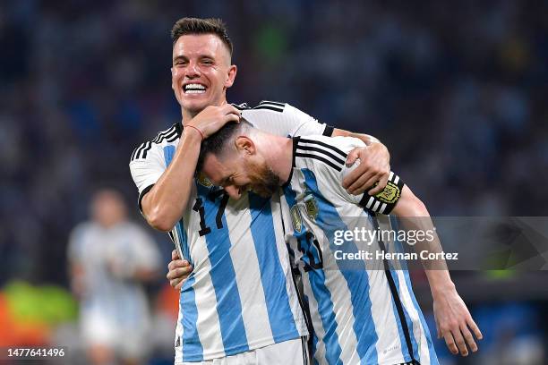 Lionel Messi of Argentina celebrates with teammate Giovani Lo Celso after scoring the team's first goal during an international friendly match...