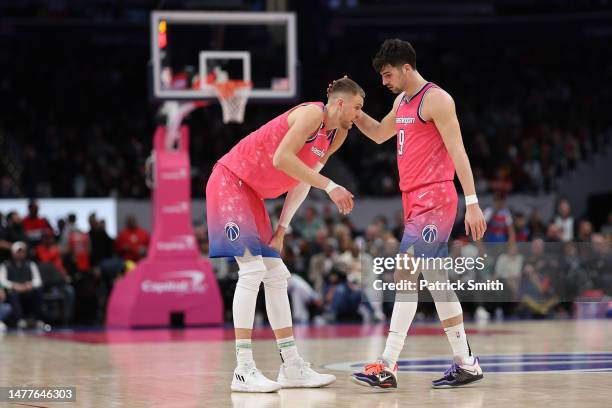 Kristaps Porzingis and Deni Avdija of the Washington Wizards acknowledge one another against the Boston Celtics during the second half at Capital One...