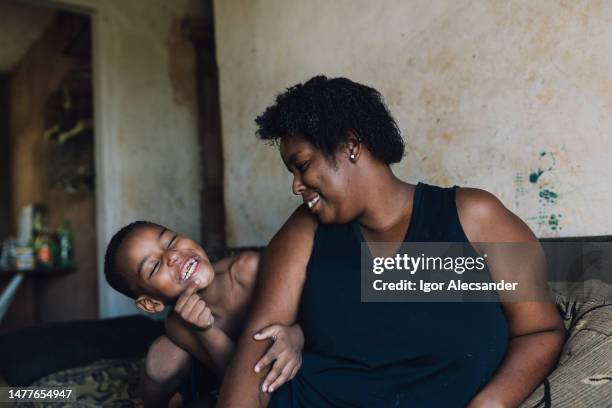 mother and son having fun at home - working class mother stock pictures, royalty-free photos & images