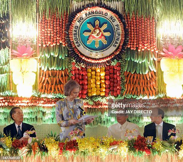 Spain's Queen Sofia speaks during a dinner in her honour as Philippine President Benigno Aquino , Philippine Senate President Juan Ponce Enrile and...