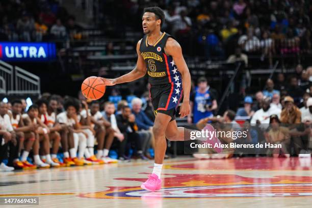 Bronny James of the West team dribbles the ball during the 2023 McDonald's High School Boys All-American Game at Toyota Center on March 28, 2023 in...
