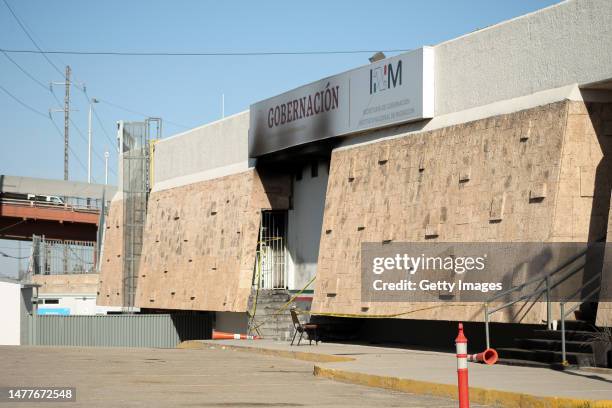 An entry of an immigration detention center in northern Mexico is cordoned-off and shows the signs of a fire on March 28, 2023 in Ciudad Juarez,...
