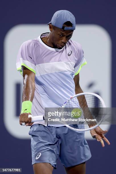 Christopher Eubanks returns a shot to Adrian Mannarino of France during the Miami Open at Hard Rock Stadium on March 28, 2023 in Miami Gardens,...