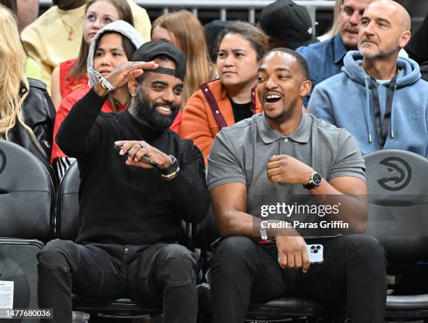 Todd Tucker and Anthony Mackie attend the game between the Cleveland Cavaliers and the Atlanta Hawks at State Farm Arena on March 28, 2023 in...