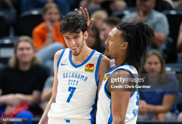 Jalen Williams of the Oklahoma City Thunder congratulates teammate Chet Holmgren after he scored against the Utah Jazz during the first half of their...