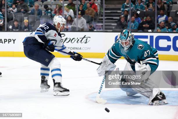 James Reimer of the San Jose Sharks makes a save on a shot taken by Nino Niederreiter of the Winnipeg Jets in the third period at SAP Center on March...