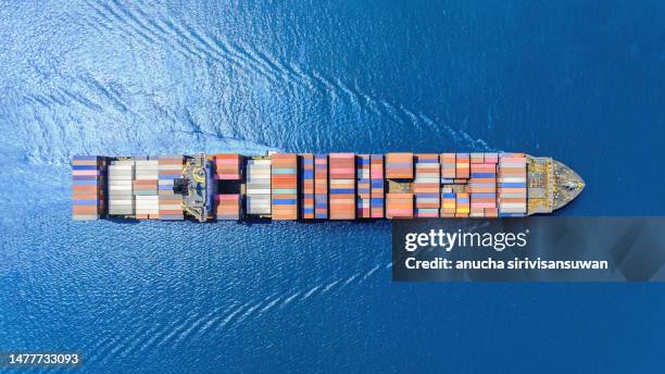 aerial top view container ship park for import export logistics in pier, thailand. - trader stock pictures, royalty-free photos & images