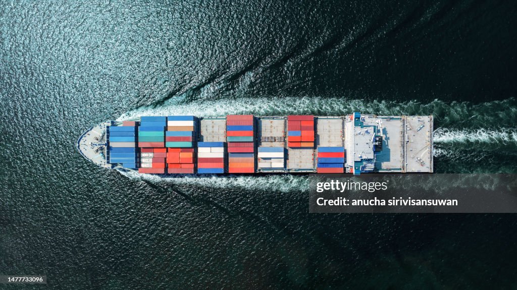 Aerial top view container ship Park for import export logistics in pier, thailand.