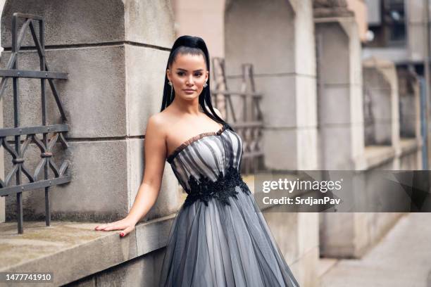 beautiful young caucasian woman in a prom dress - prom dress stock pictures, royalty-free photos & images