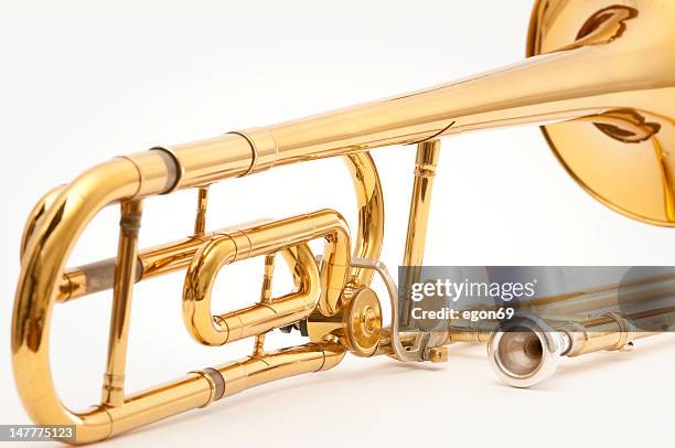 trombone close isolated on white - trombone stock pictures, royalty-free photos & images