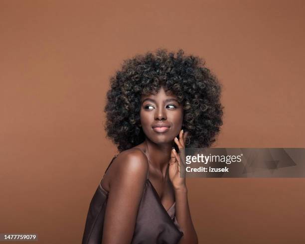 portrait of beautiful young woman with afro hair - woman thinking stock pictures, royalty-free photos & images