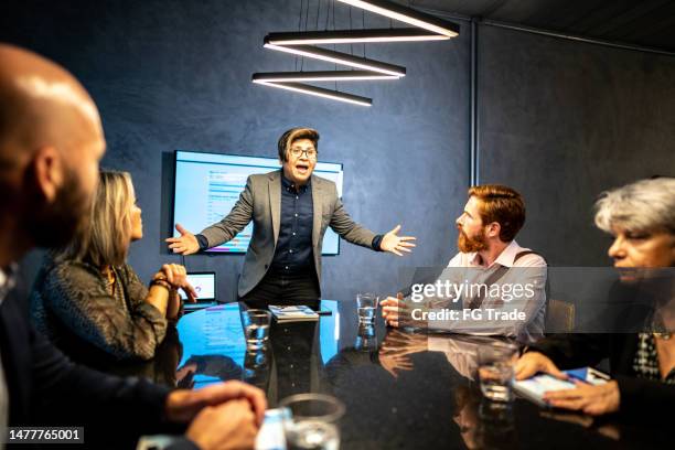 anger businessman talking in a meeting at the office - deadline contenders stock pictures, royalty-free photos & images