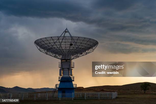 satellite receiving antenna at sunset - radio telescope stock pictures, royalty-free photos & images