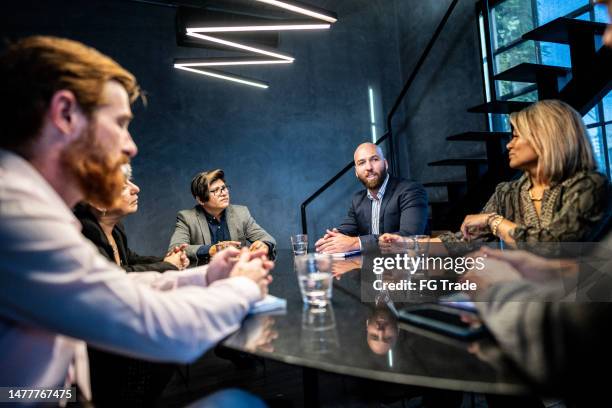 business people in a meeting at the office - director office stock pictures, royalty-free photos & images