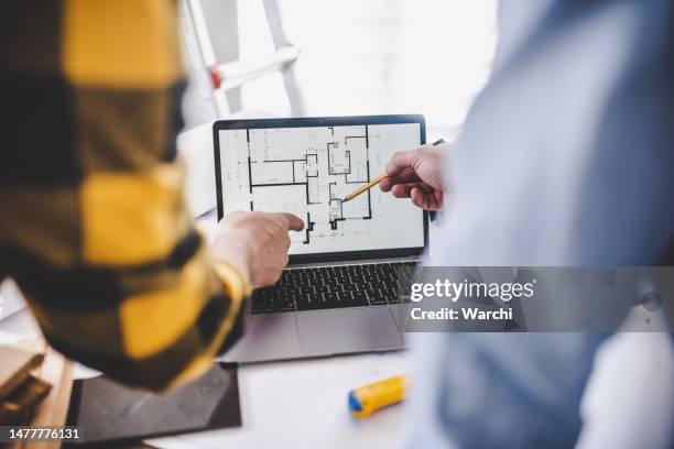 hands of two architects pointing at the architectural plan on the screen - quality stock pictures, royalty-free photos & images