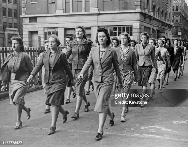 Female recruits for the Women's Auxiliary Home Guard march on parade through Whitehall on 23rd July 1942 at Whitehall in London, England .