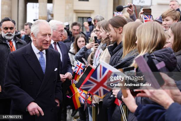 King Charles III and German President Frank-Walter Steinmeier meet members of the public during the Ceremonial welcome at Brandenburg Gate on March...