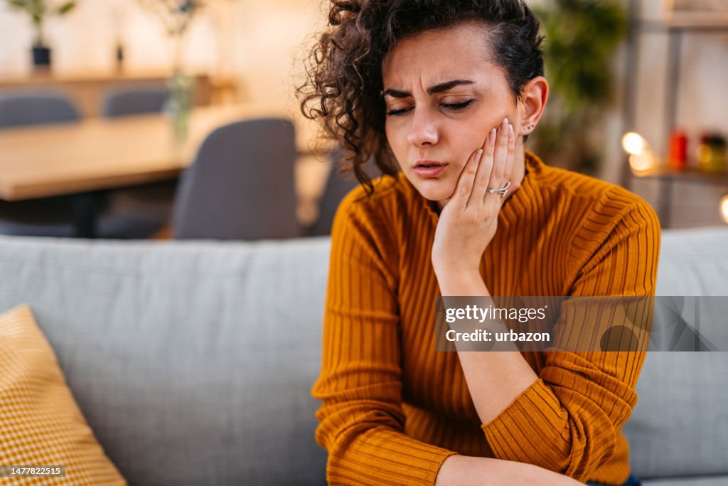 Young Woman Having Toothache At Home