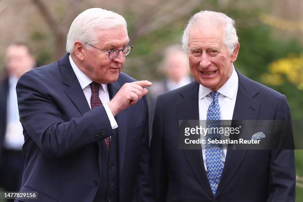 German President Frank-Walter Steinmeier and King Charles III walk together in the gardens on their way to plant a tree as part of the Queen’s Green...